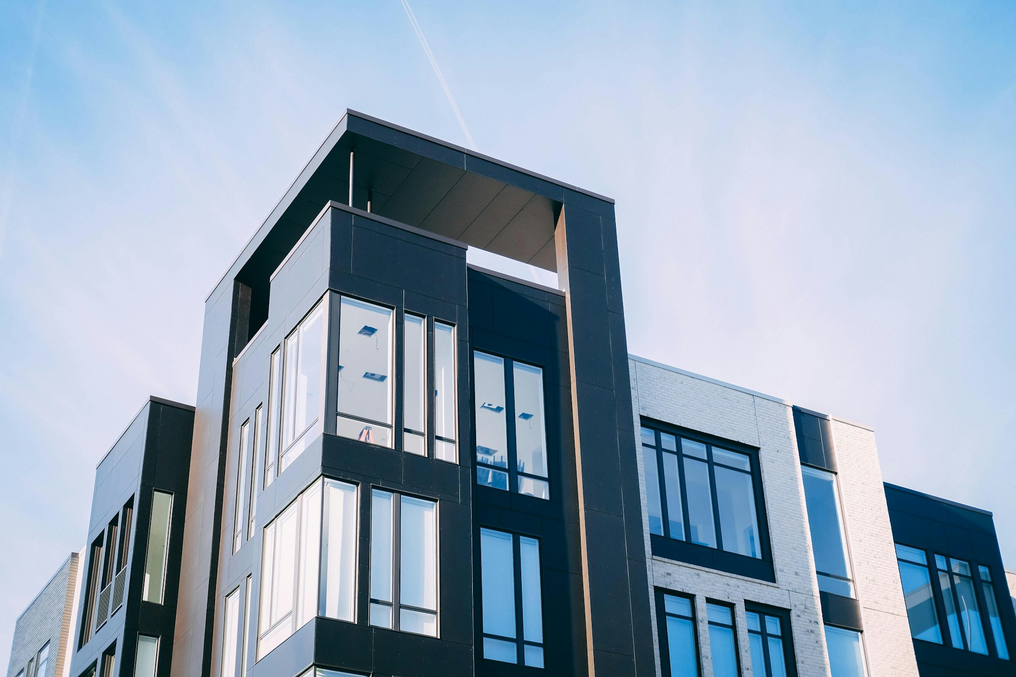 Low rise residential building with balconies and large windows